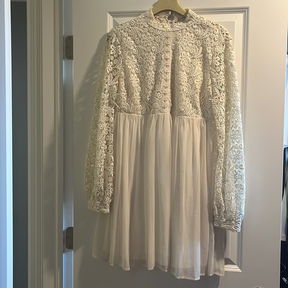 High neck, button down. White flowy dress